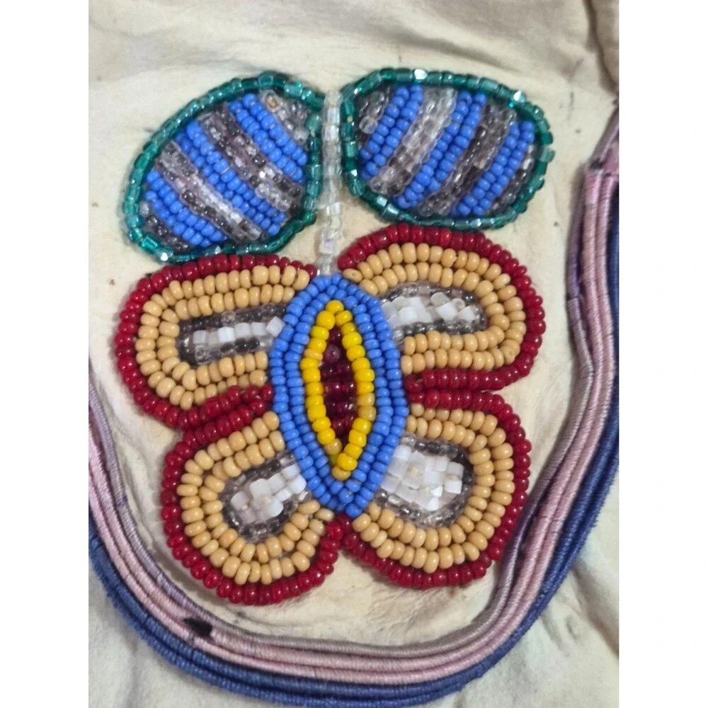 Vintage Crow Beaded Hide Moccasins featuring Intricate Colorful Glass Beadwork
